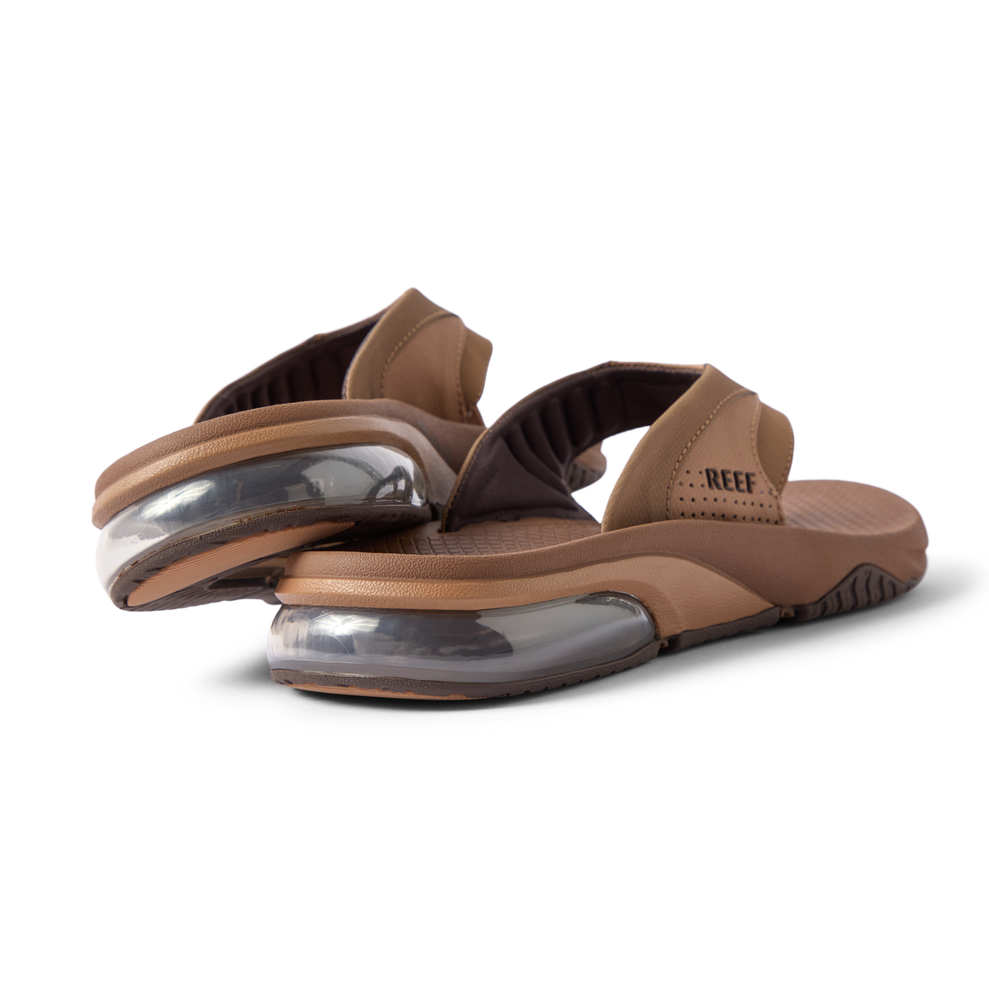Rear close-up of brown Fanning + men's sandals showing soft-rebound cushioning and anatomical arch support, facing right.