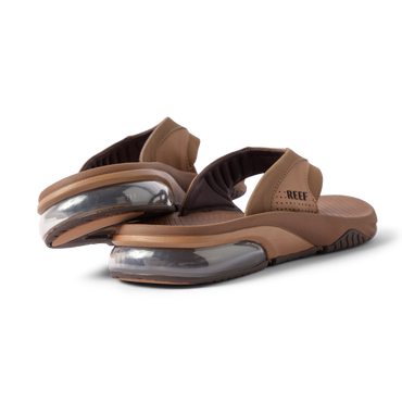 Rear close-up of brown Fanning + men's sandals showing soft-rebound cushioning and anatomical arch support, facing right.