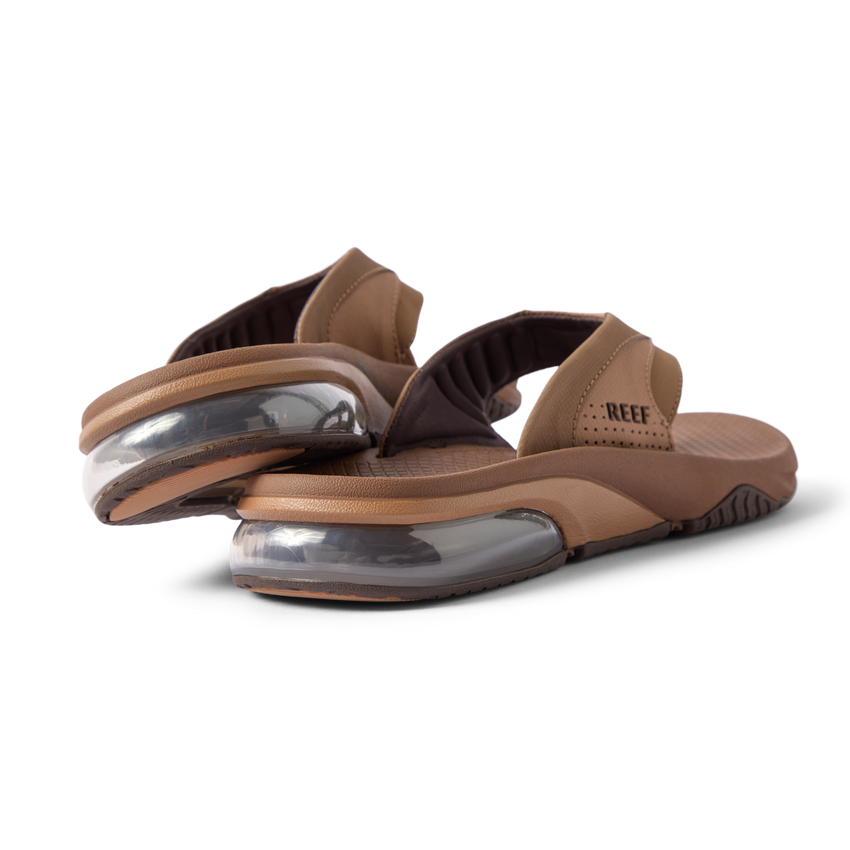 Rear close-up of brown Fanning + men's sandals showing soft-rebound cushioning and anatomical arch support, facing right.