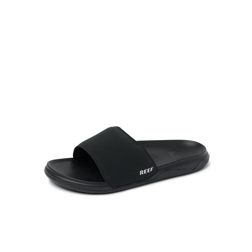 Tailslide black slide sandal facing right, showing top and side, with anatomical arch support and cushioned footbed.