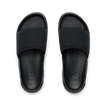 Tailslide men's black slides facing up, close-up of footbeds with textured cushioning and arch support for water-friendly comfort.