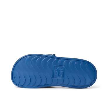 Kids Salty Slide outsole facing up, showing durable, water-friendly sole with anatomical arch support and REEF branding.