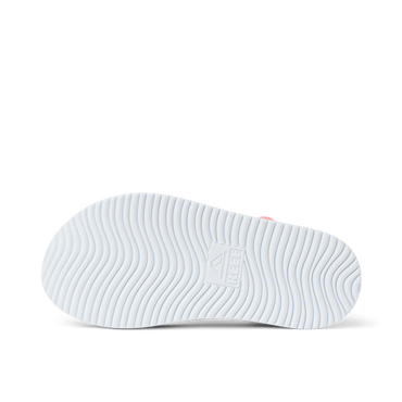 Little Cali Coastin showing the outsole facing up, highlighting textured grip with REEF anatomical arch support for comfort.