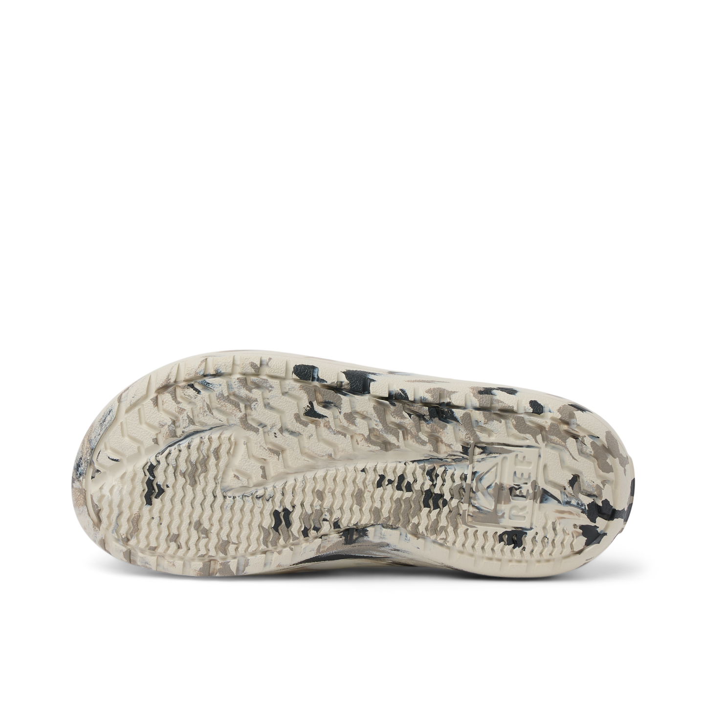 Glider sandal outsole facing up with textured tread in beige and black, showing durable water-friendly sole design