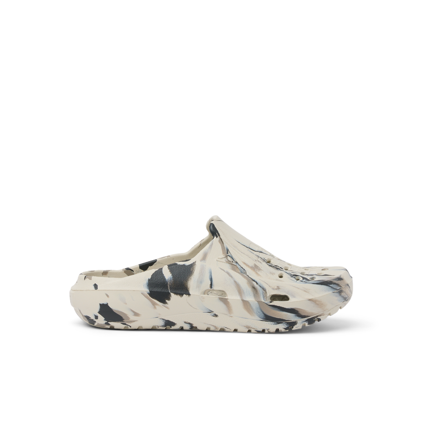 A single Croc-style clog shoe in a marbled cream, beige, black, and gray colorway, shown from a side profile on a clean white background.