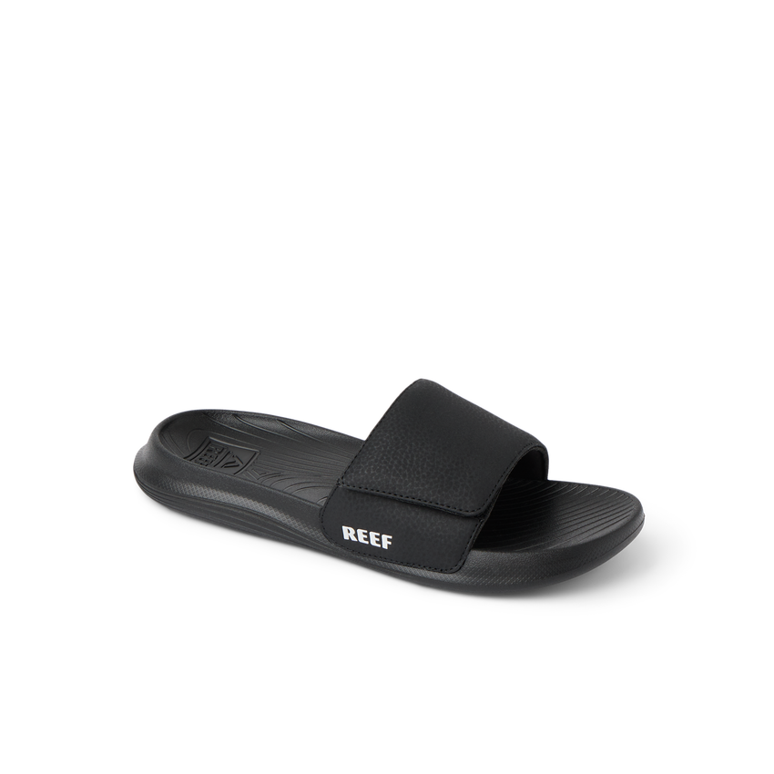 Kids Salty Slide facing right, black and white, beach-inspired slide with anatomical arch support and soft cushioning.