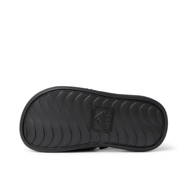 Kids Salty Slide showing the sole with wave-pattern grip, designed for comfort and durability, facing downwards, boys size.