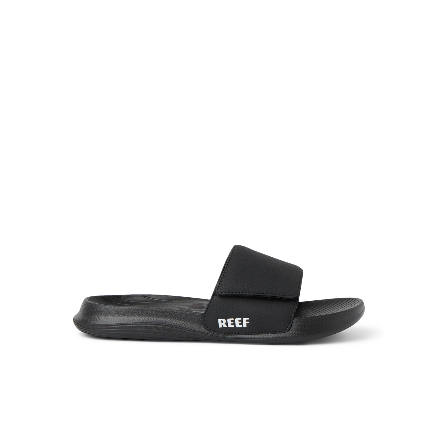 Kids Salty Slide black right-facing side view showing soft-rebound cushioning and anatomical arch support in a beach-inspired slide.