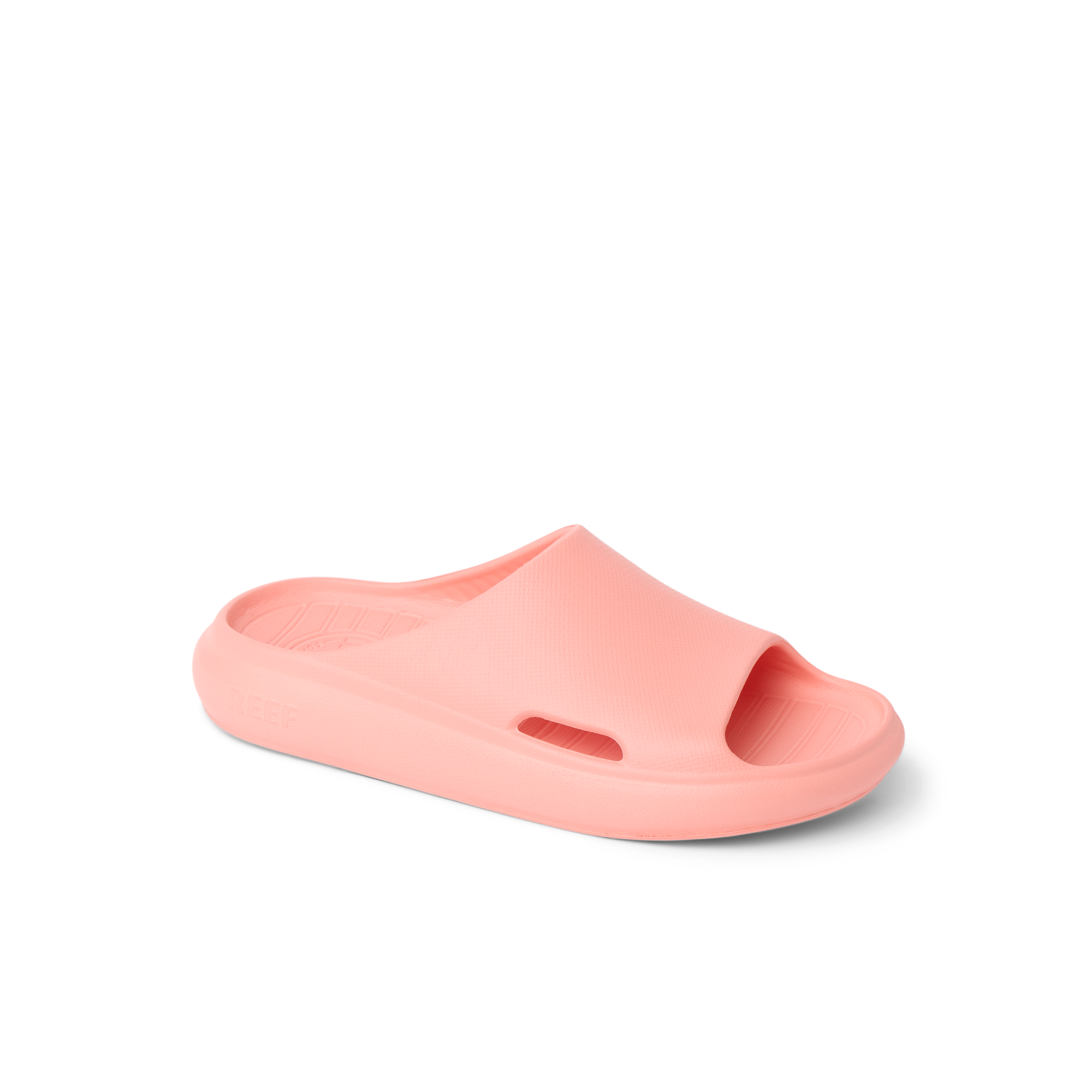 Kids Rio Slide coral-colored unisex footwear facing left, close-up of the top and side, with water-friendly, cushioned design.