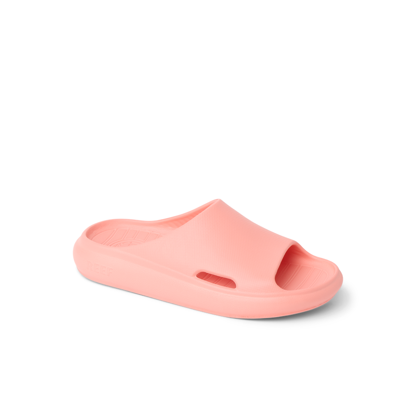 Kids Rio Slide coral-colored unisex footwear facing left, close-up of the top and side, with water-friendly, cushioned design.