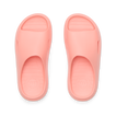 Top view of coral Kids Rio Slide unisex sandals showing molded footbed and soft-rebound cushioning for beach comfort