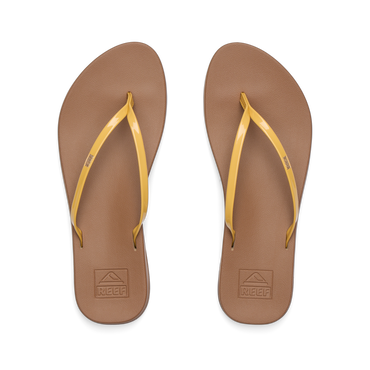 Top view of women's Cushion Slim sandals with golden apricot straps and brown footbeds, designed for beach comfort and support.