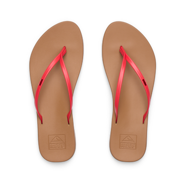 Pair of Cushion Slim women's flip-flops facing up showing tan footbed with red straps, water-friendly and comfort-focused design.