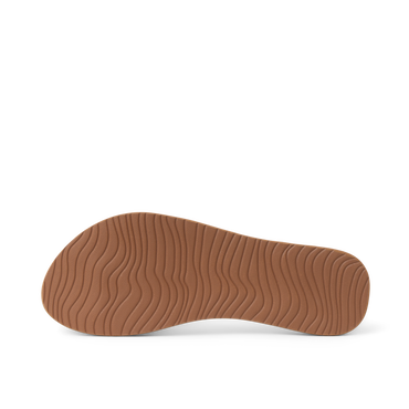 Bottom sole view of Cushion Slim women’s sandal highlighting textured, wave-patterned rubber outsole for beach comfort and durability.