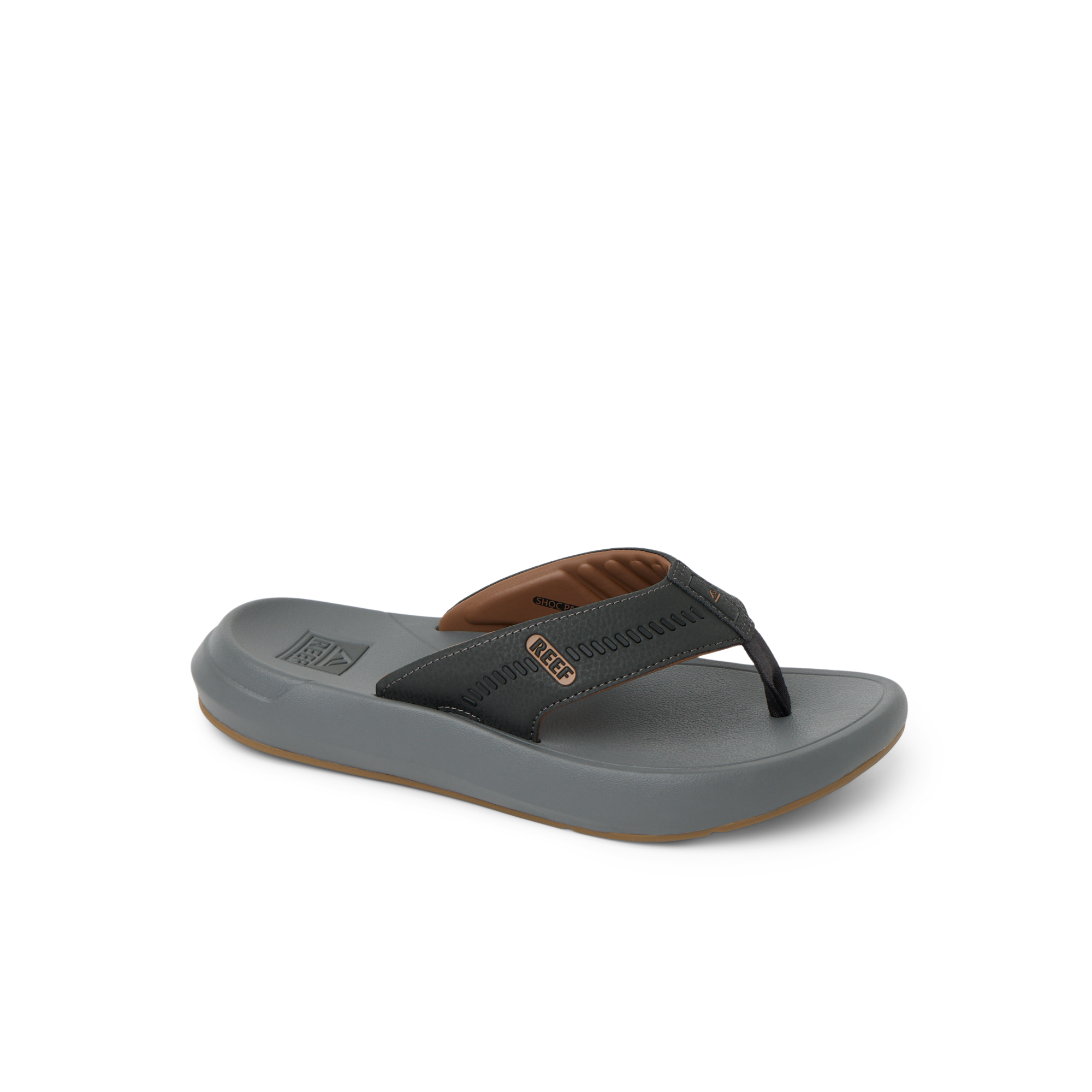 Cruiser men's sandal facing right, with brown and black straps, showing toe post and cushioned footbed for beach comfort.
