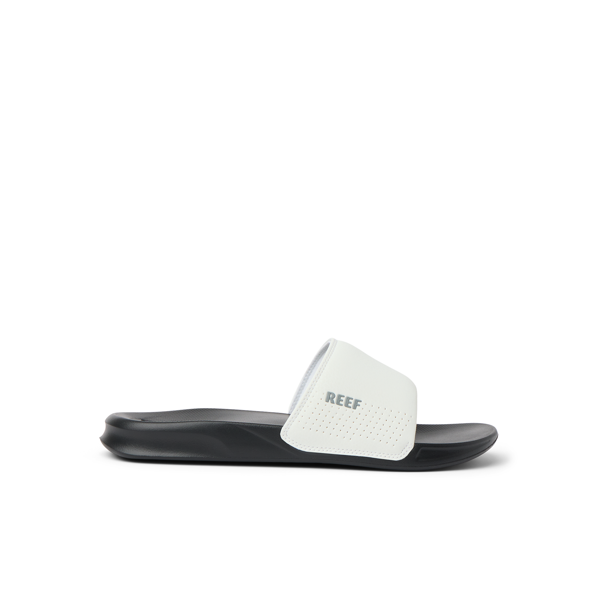 Side view of a black and white Reef One Slide sandal, water friendly and designed for beach comfort and support.