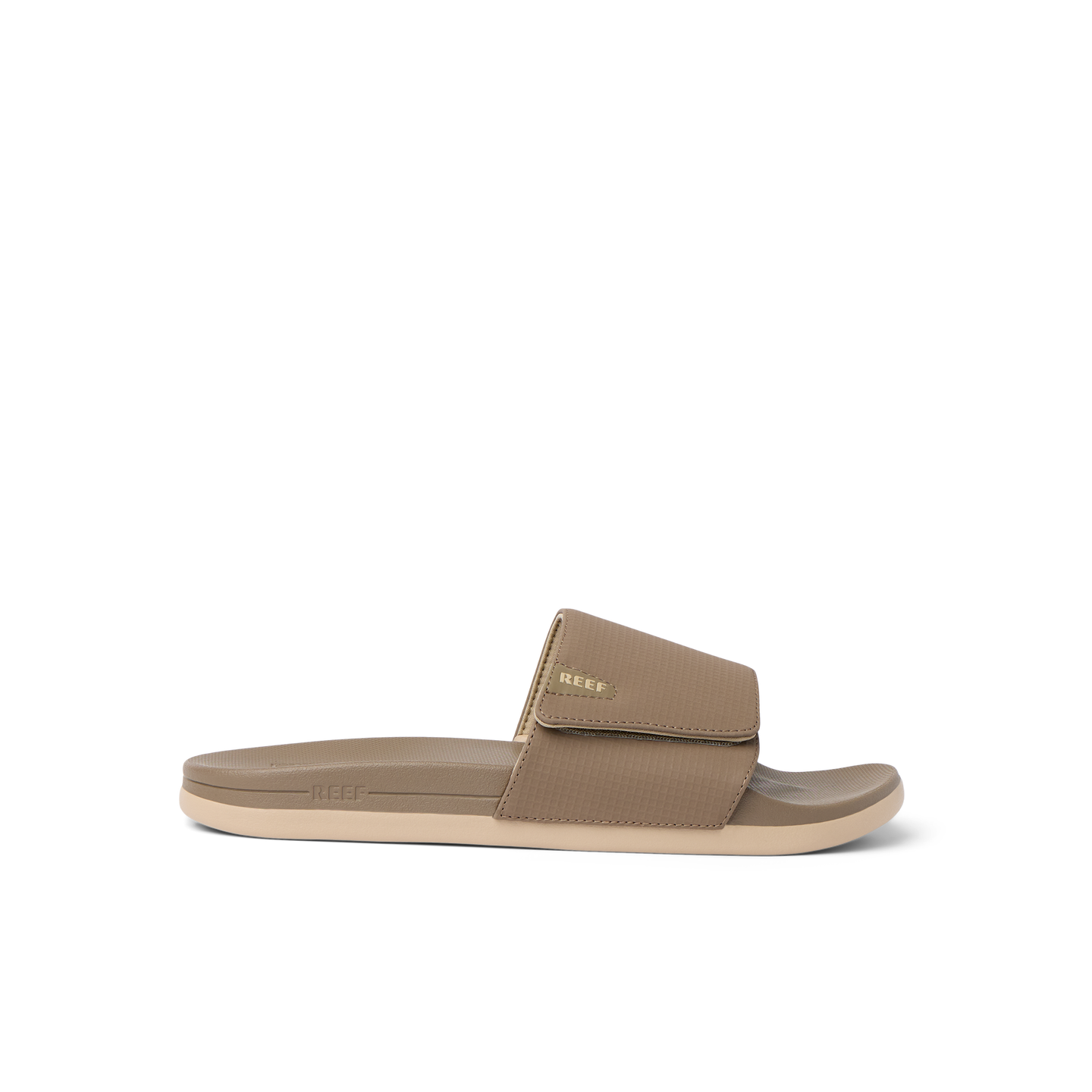 Side view of tan Cshn Phantom Slide with arch support and soft cushioning designed for beach comfort and everyday wear.