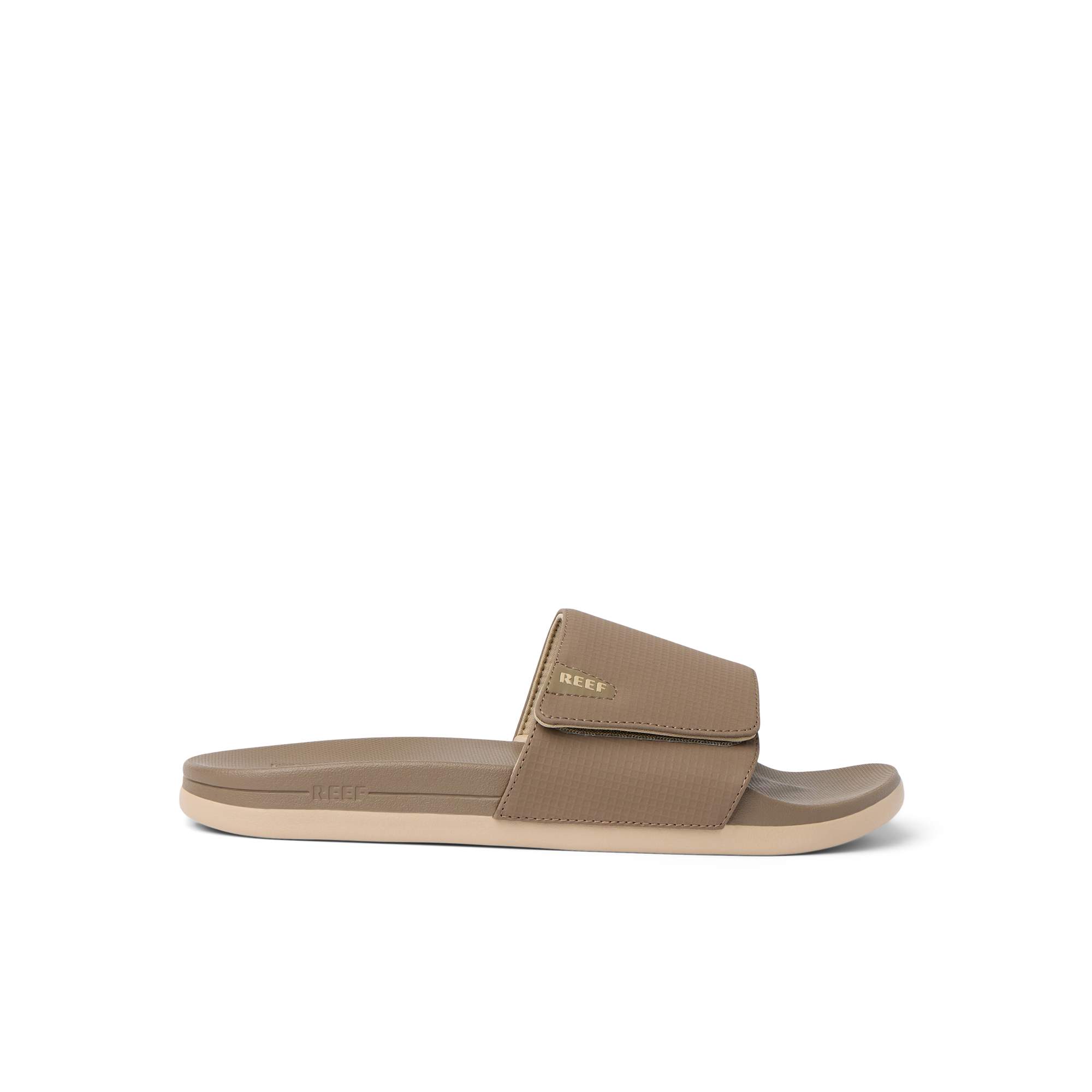 Side view of tan Cshn Phantom Slide with arch support and soft cushioning designed for beach comfort and everyday wear.