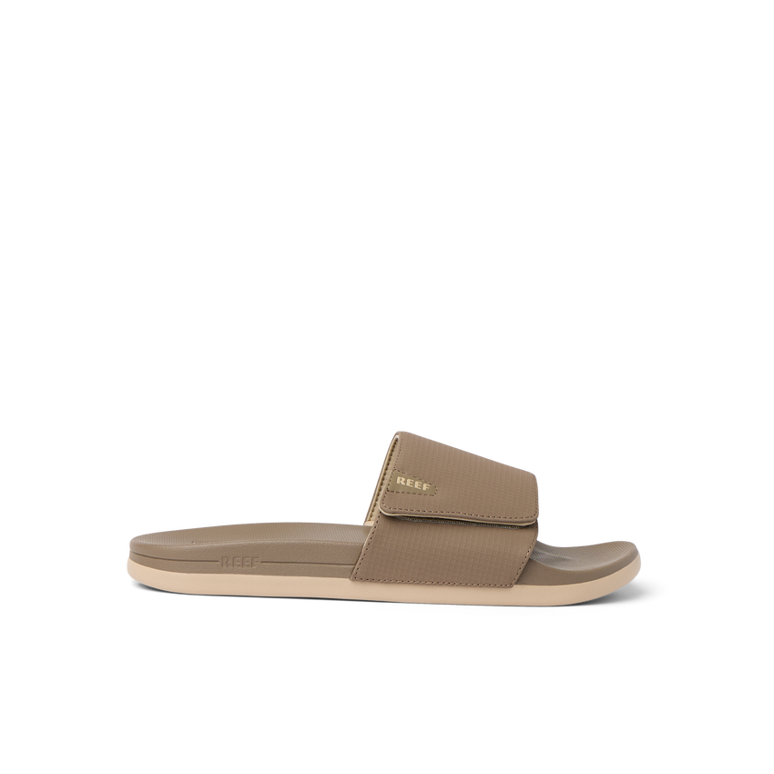 Side view of tan Cshn Phantom Slide with arch support and soft cushioning designed for beach comfort and everyday wear.