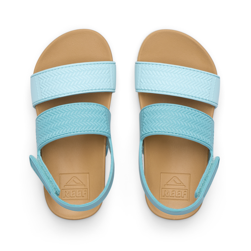 Top view of Little Water Vista girls' light blue sandals with adjustable straps and cushioned footbeds for beach comfort.