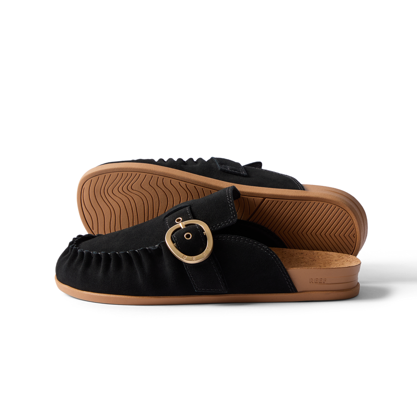 Vista Siena black suede clogs facing left, side view with buckle and textured soles