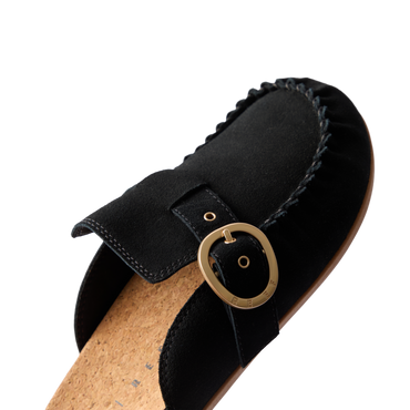 Vista Siena black suede clog close up, facing lower left, with buckle and cork footbed