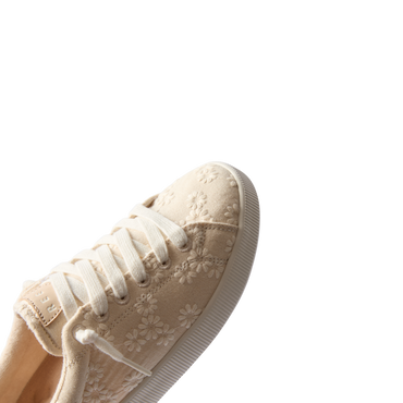 Close-up of Neptune Alana women's sneaker facing right with floral embroidery, extra cushioning, and arch support.