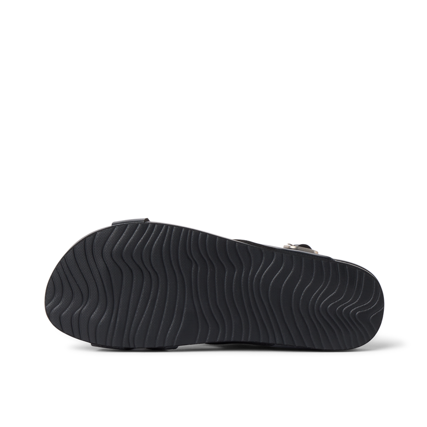 Vista Malia black sandal outsole facing up, showing textured, water-friendly sole with cushioned arch support