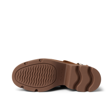 Vista Luxe Solene clog sole close-up showing brown platform outsole with structured arch support, facing upwards.