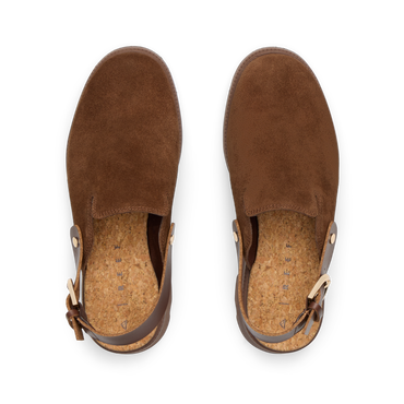Top-down view of brown suede Vista Luxe Solene clogs facing upward, featuring adjustable buckle straps and cushioned footbeds.