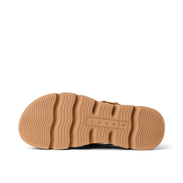 Vista Luxe Liah outsole facing up, tan rubber sole with wave-inspired tread for durable, beach-ready traction and comfort