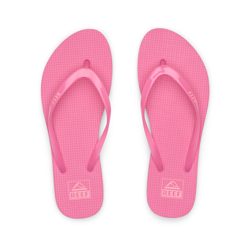 Kids Charming bright pink girls’ flip flops, top view, soft cushioning, water-friendly, beach-inspired comfort and durability.