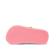 Little Ahi girls’ sandal showing bottom sole facing up with textured REEF branding in pink, lightweight comfort design.