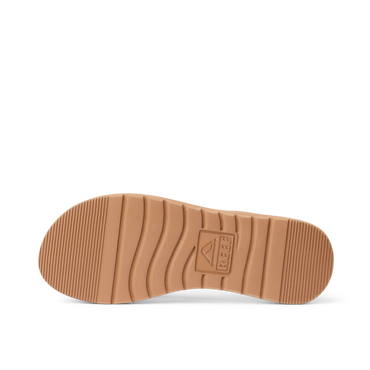 Close up of Playa Bella flip flop outsole facing up with toe pointing left and textured traction grooves