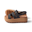 Water Vista Higher 2 women's black and tan platform sandal facing right, showcasing cushioned sole and water-friendly straps.