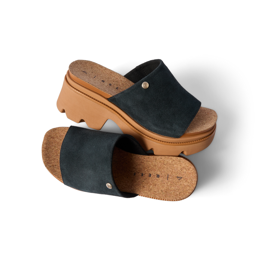 Vista Luxe Evie black suede platform sandals with right shoe facing left, showcasing arch support and cork footbed detail.