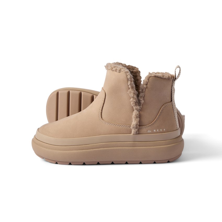 Pair of tan Weekend Autumn boots facing left with shearling lining, soft cushioning, and durable rubber sole by REEF.