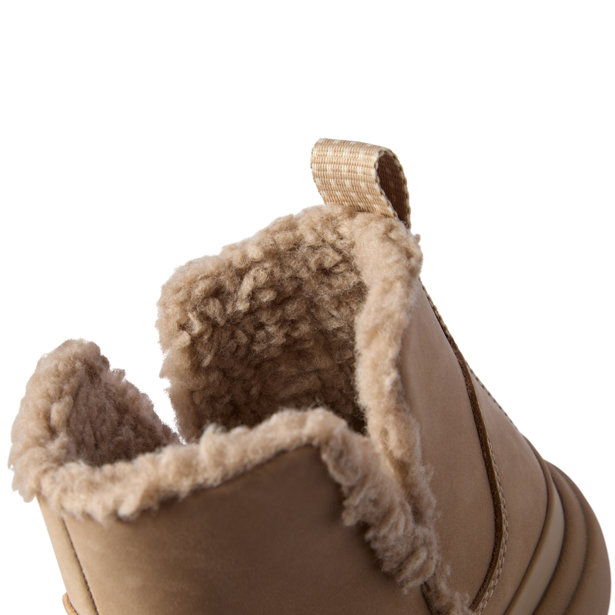Close-up of the top opening and heel of the right Weekend Autumn shoe showing plush lining and brown leather exterior.