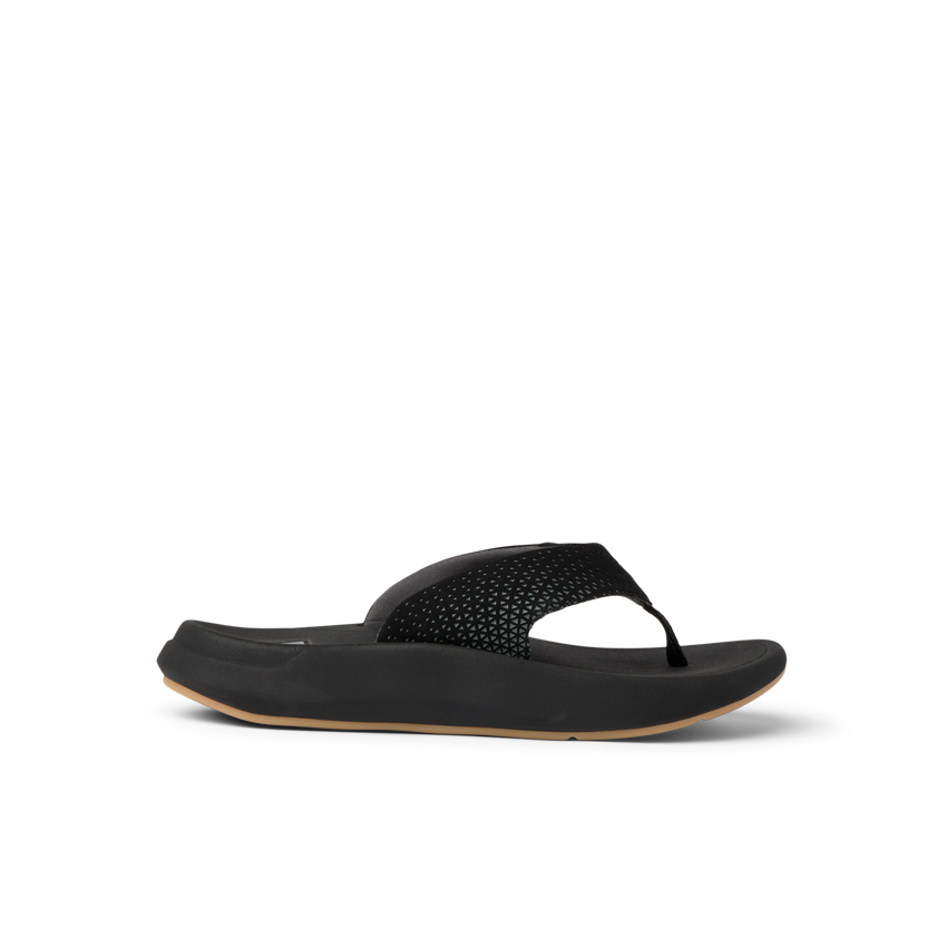 Rover + right-facing sandal with black perforated straps, cushioned footbed, and durable outsole for beach comfort.