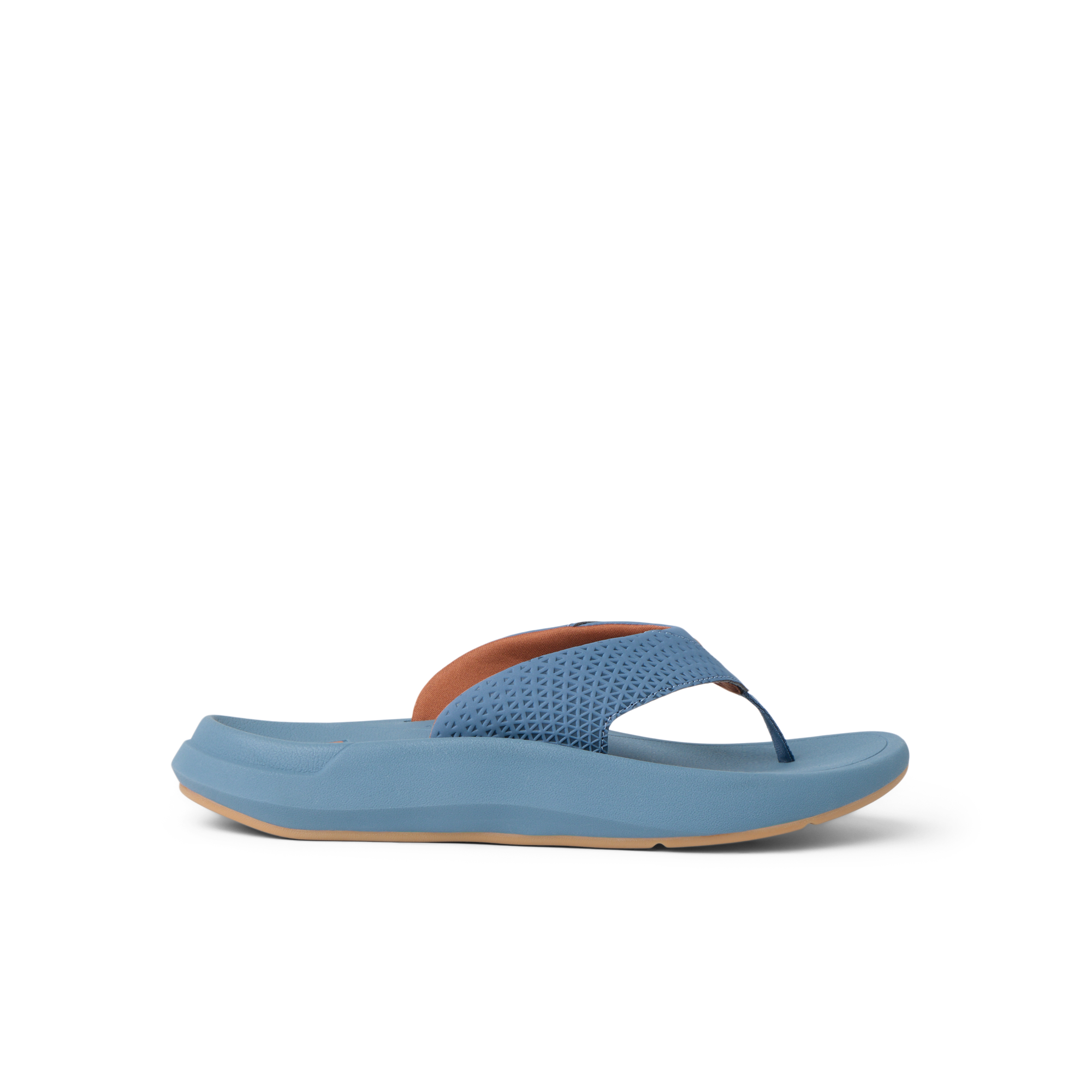 Side view of Rover + blue flip flop sandal with anatomical arch support and soft cushioning, designed for beach comfort.