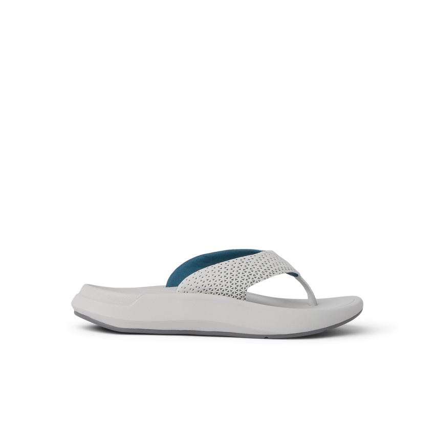 Side view of Rover + white and blue sandal with anatomical arch support and soft cushioning for beach comfort