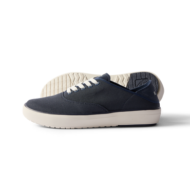 Side view of navy Neptune Lido men's sneaker with white sole, surf-inspired comfort and anatomical arch support.