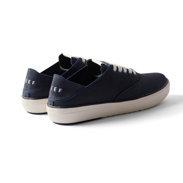 Neptune Lido navy sneakers facing left showing heel and side, surf-inspired comfort with anatomical arch support and cushioning.