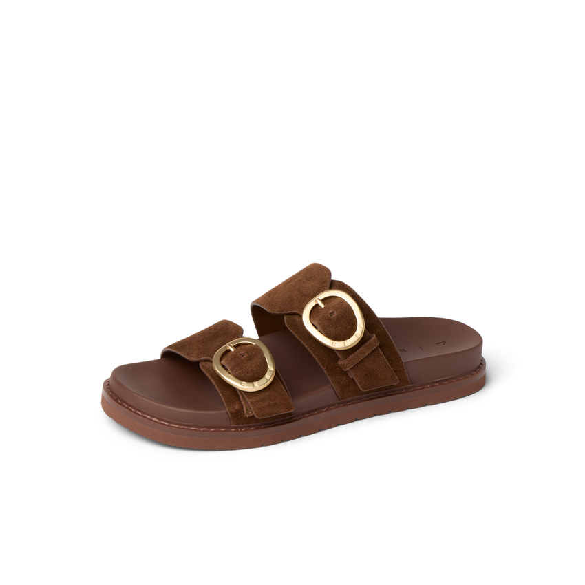 Vista Daphne slide sandal facing right, close-up of brown suede straps with gold buckles, arch support style.