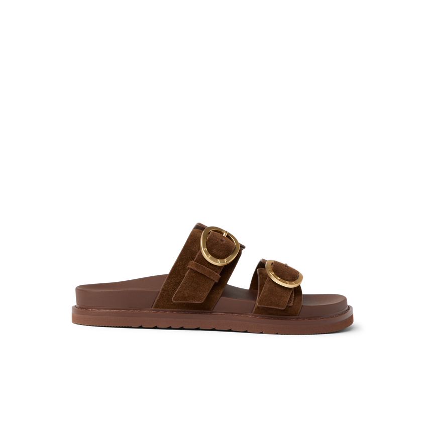 Vista Daphne slide sandal facing right, chocolate suede with adjustable buckles, arch support for all-day beach comfort.