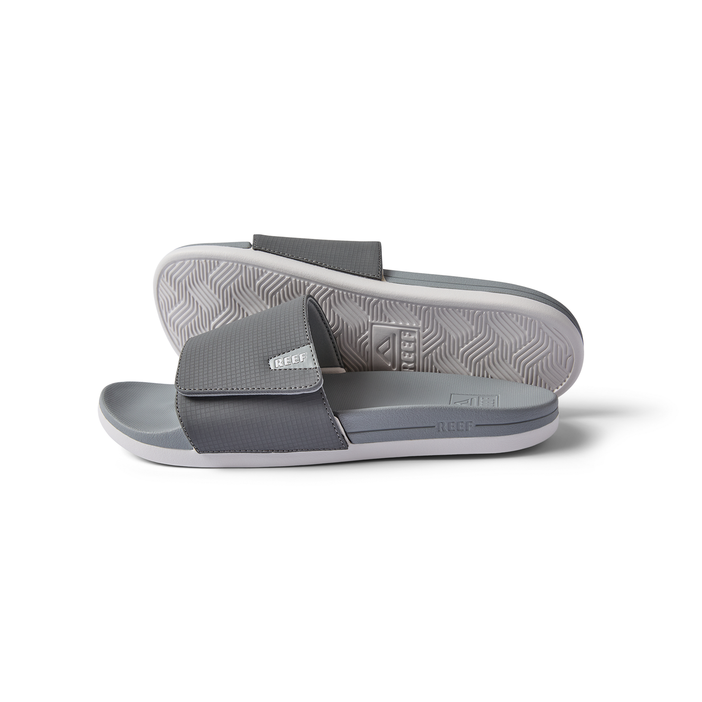 Side and bottom views of gray Cshn Phantom Slide with soft-rebound cushioning and arch support for beach comfort