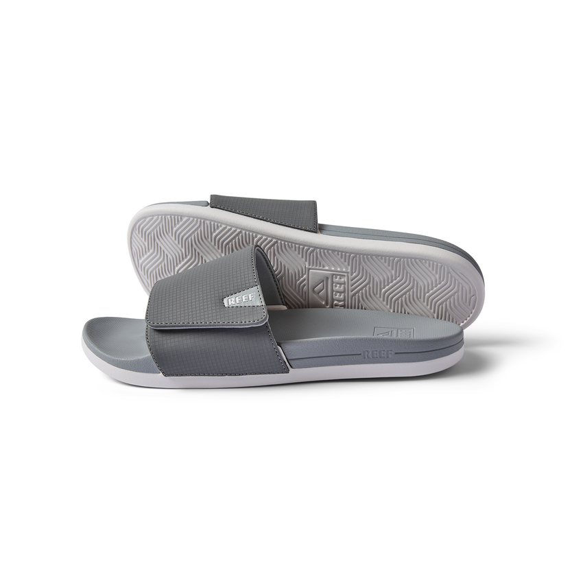 Side and bottom views of gray Cshn Phantom Slide with soft-rebound cushioning and arch support for beach comfort