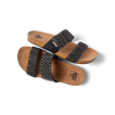 Pair of Cushion Vista women's sandals with black textile straps and cork footbed, right sandal facing left, top view close-up.