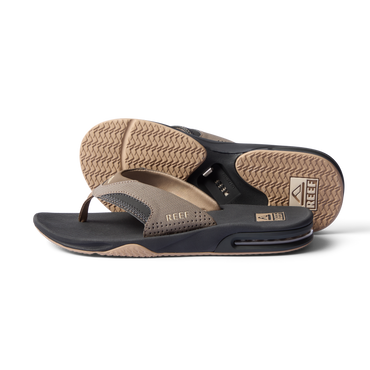 Pair of Fanning flip flops, one facing left side and one sole up, showing cushioned arch support and water-friendly materials.