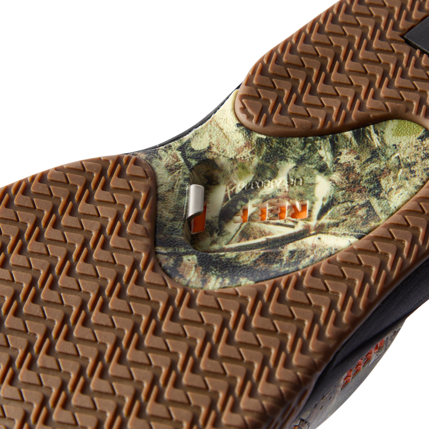 Close-up of the rubber sole on the Fanning men's shoe facing upward, featuring extra cushioning and camouflage design.